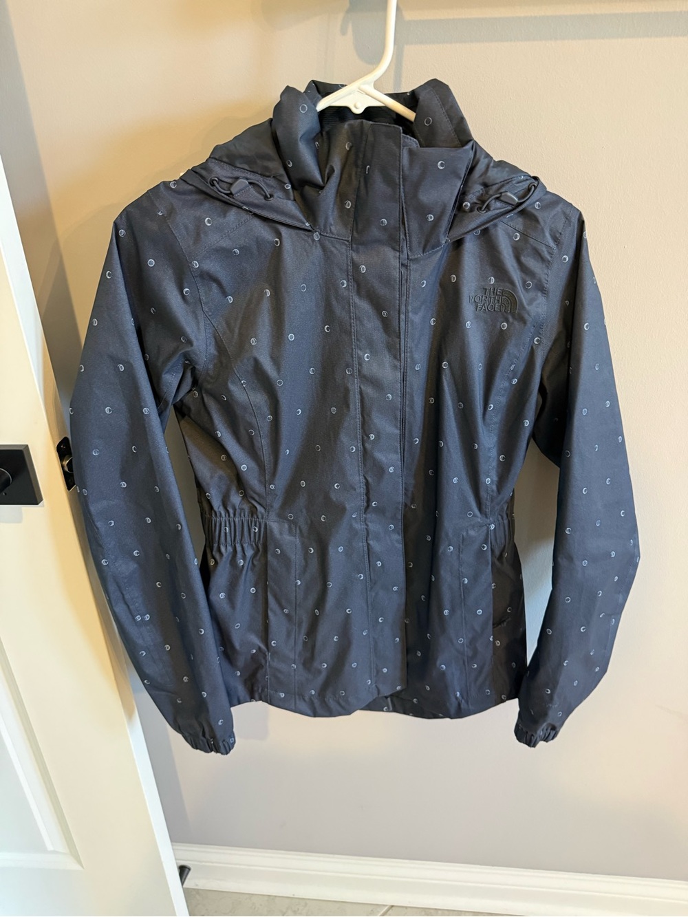 The North Face Navy Blue Hooded Rain Jacket with Subtle Dot Print